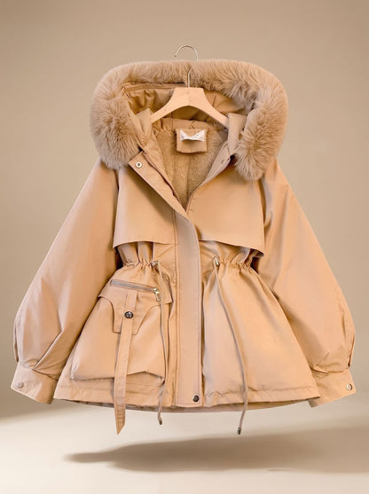 Women's quilted winter jacket by Homixa with hood, fur collar, and adjustable drawstring waist, designed for warmth and style.