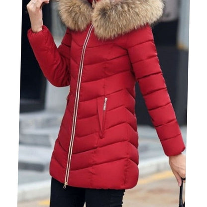 Women's quilted parka by Homixa with vegan-fur hood trim, chevron pattern, and gold zippers for stylish winter wear.