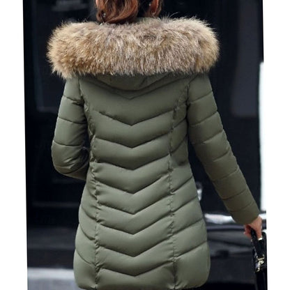Women's quilted parka by Homixa with vegan-fur hood trim, chevron pattern, and gold zipper details.