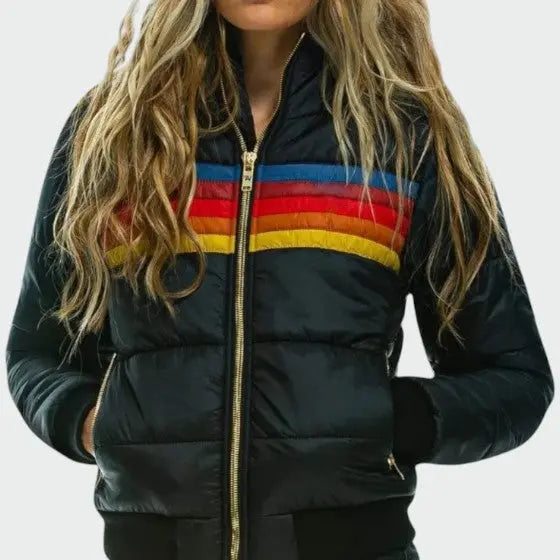 Women's Homixa quilted puffer jacket with stripe pattern and zip-front closure, shown on a model in a stylish outdoor setting.