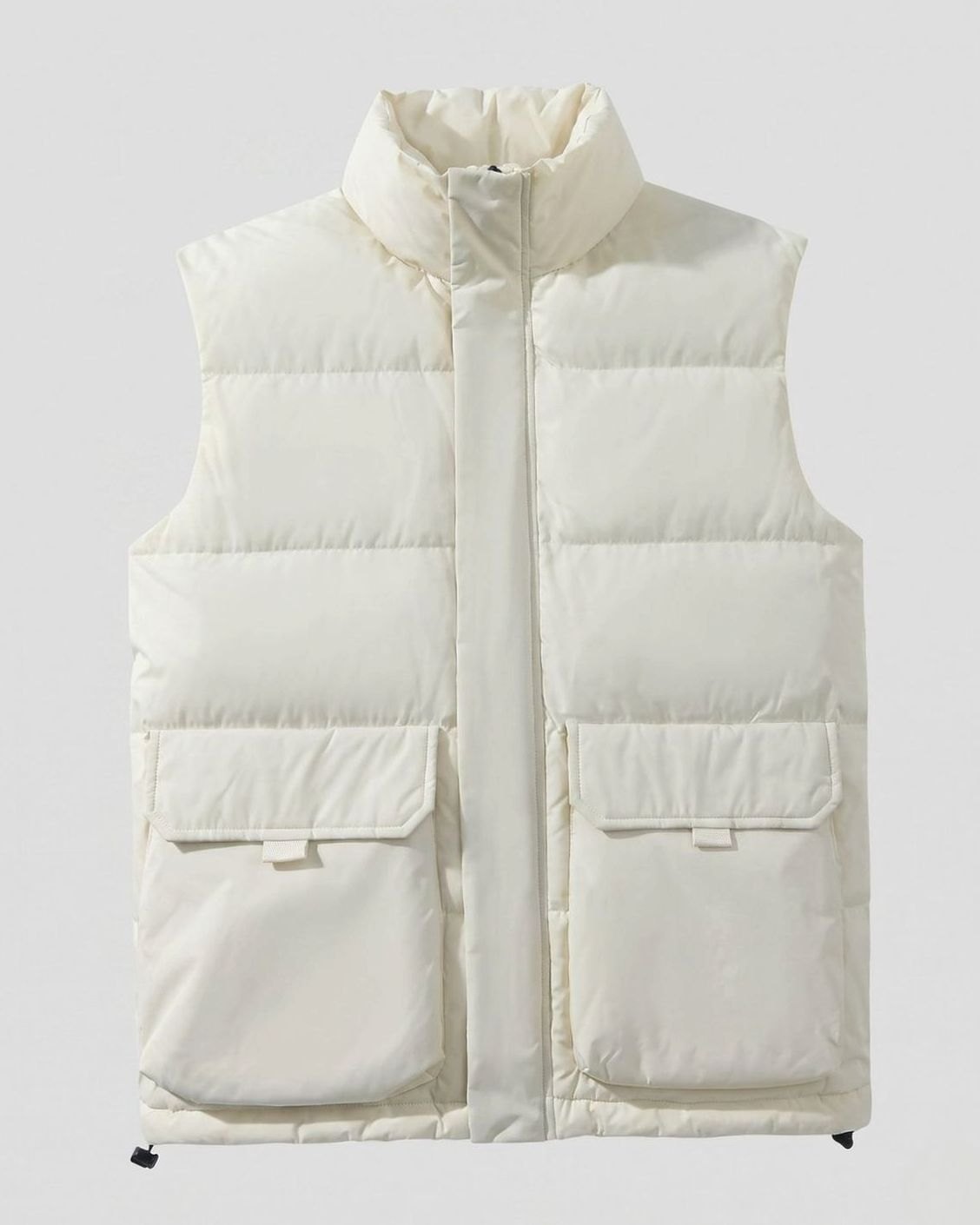 Women's Homixa quilted sleeveless puffer vest with stand collar and flap pockets, shown on a model in a casual outdoor setting.