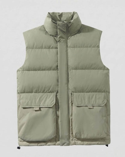 Women's quilted sleeveless puffer vest by Homixa featuring a stand collar and flap pockets, shown on a model.
