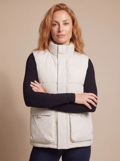 Women's Homixa quilted stand-collar puffer vest with flap pockets and hidden zip, offering stylish warmth and comfort.