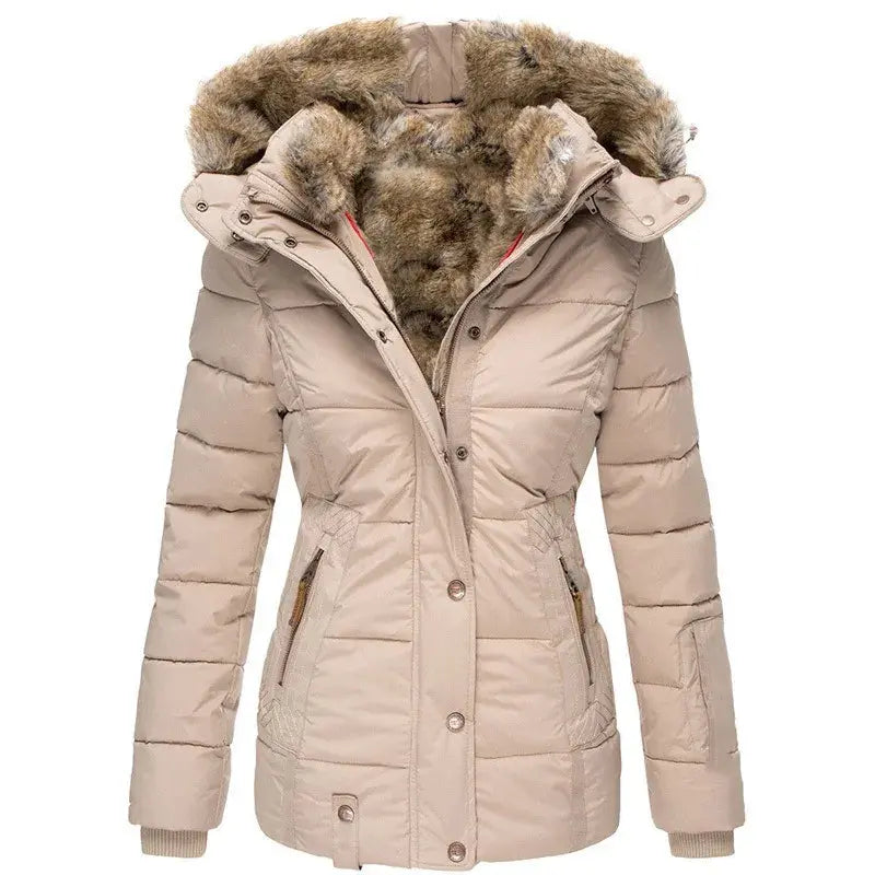 Women's quilted winter jacket by Homixa with fur-lined hood and zippered pockets, shown on a model standing outdoors.