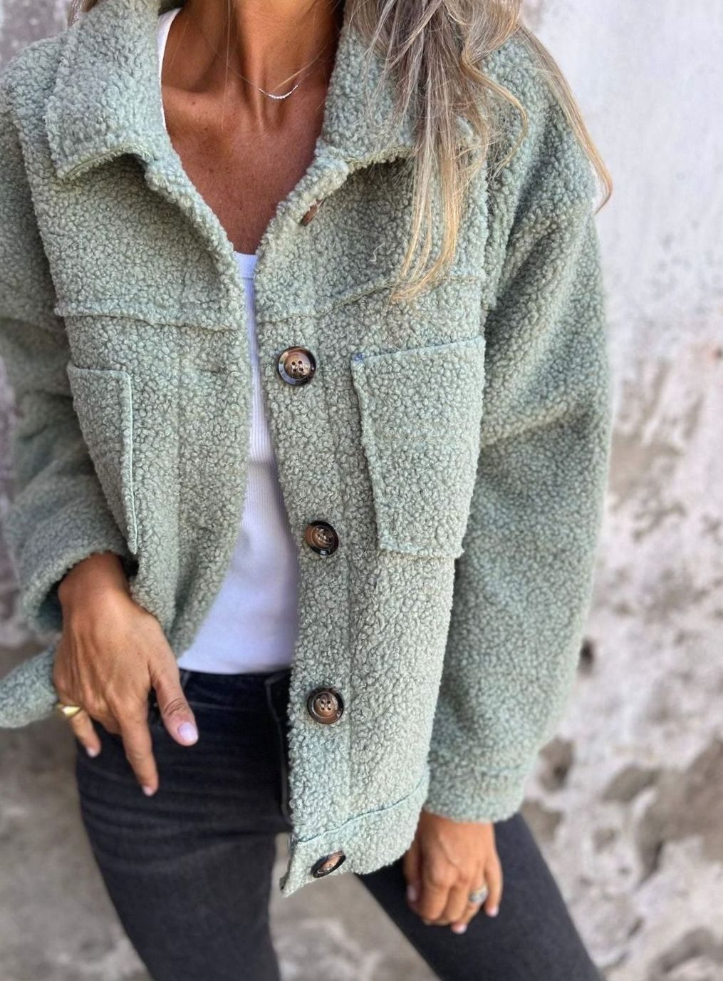 Women's relaxed-fit Teddy fleece jacket by Homixa with button front and chest pockets, shown in a cozy, plush fleece material.