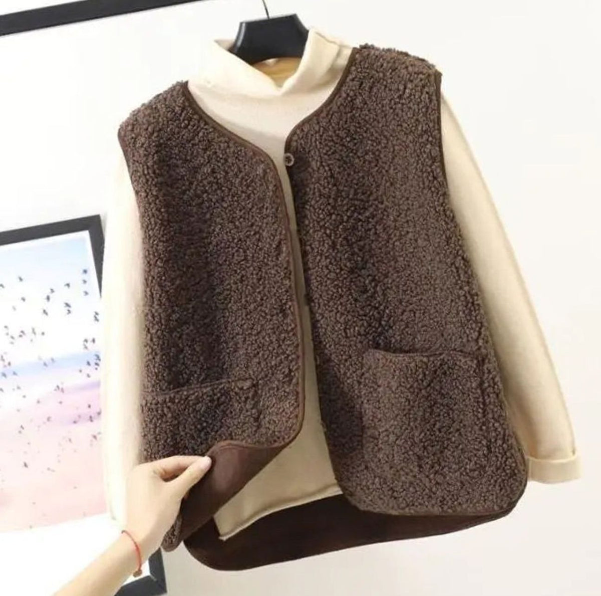 Women's relaxed-fit Sherpa vest with button-front closure and sleeveless design by Homixa, showing soft, cozy fabric and casual style.