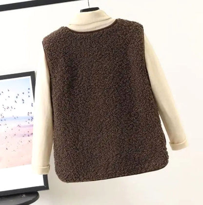 Women's relaxed-fit Sherpa vest with button front and sleeveless design by Homixa, showcasing cozy fabric and casual style.