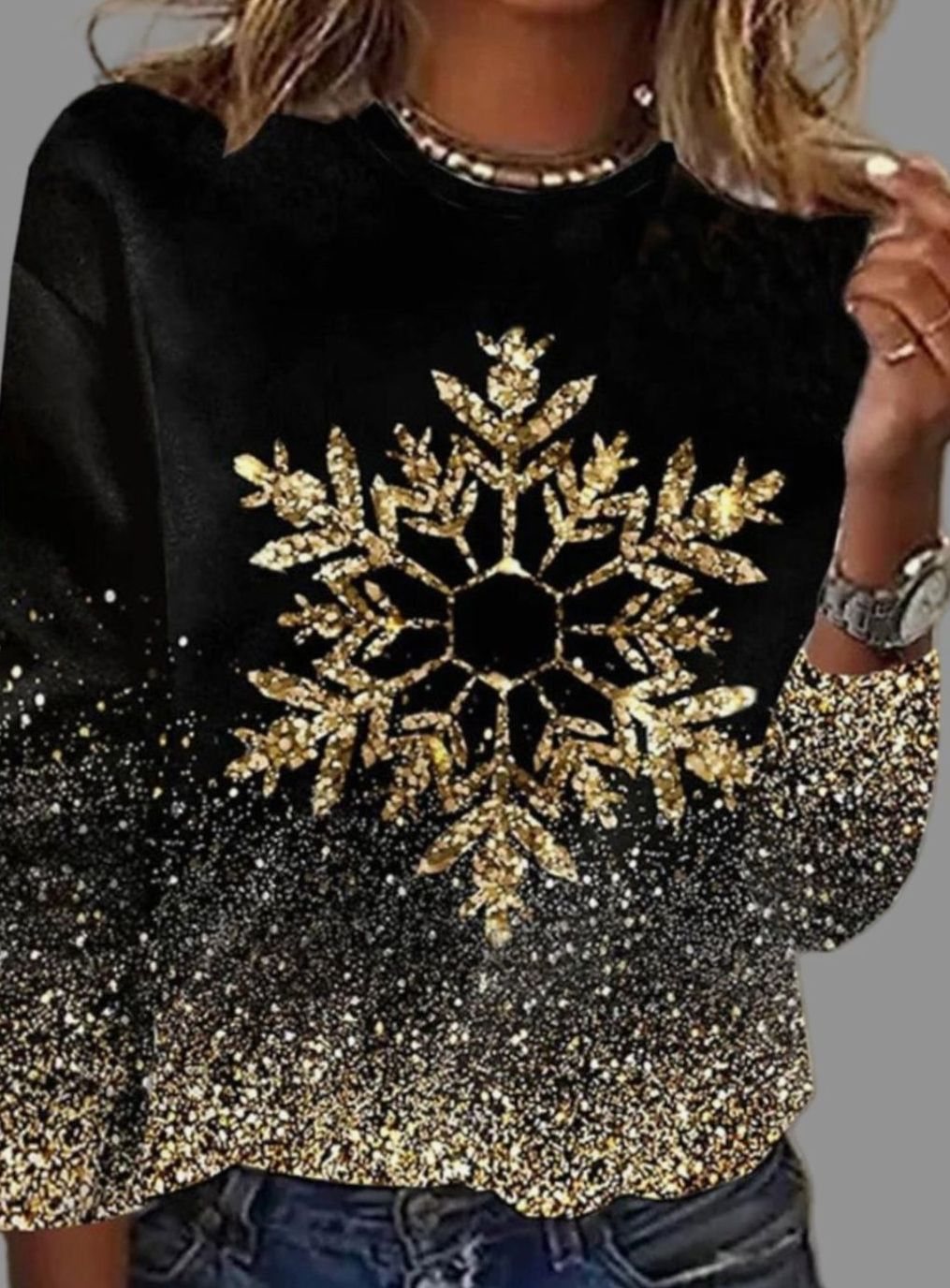 Women's relaxed-fit Christmas sweater by Homixa featuring gold-glitter snowflakes on black fabric, cozy holiday winter apparel.
