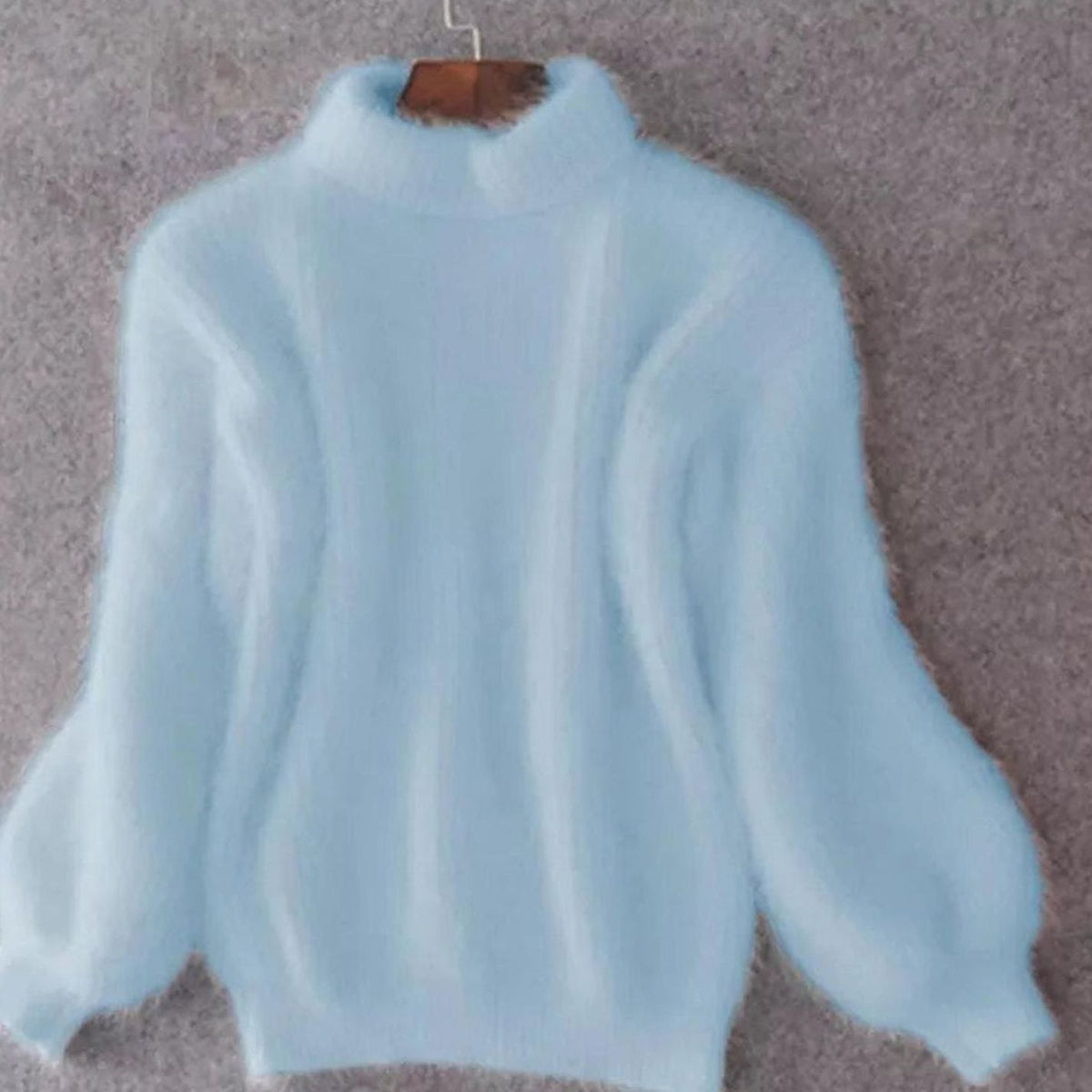 Women’s relaxed-fit fuzzy rib-knit turtleneck sweater with wide sleeves by Homixa, showcasing its cozy, fluffy texture and stylish design.