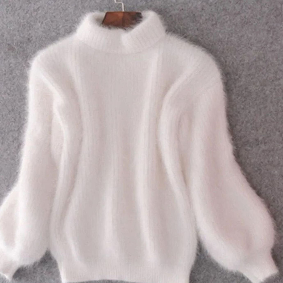 Women's relaxed-fit fuzzy rib-knit turtleneck sweater with wide sleeves by Homixa, showcasing cozy, fluffy knit fabric and stylish design.
