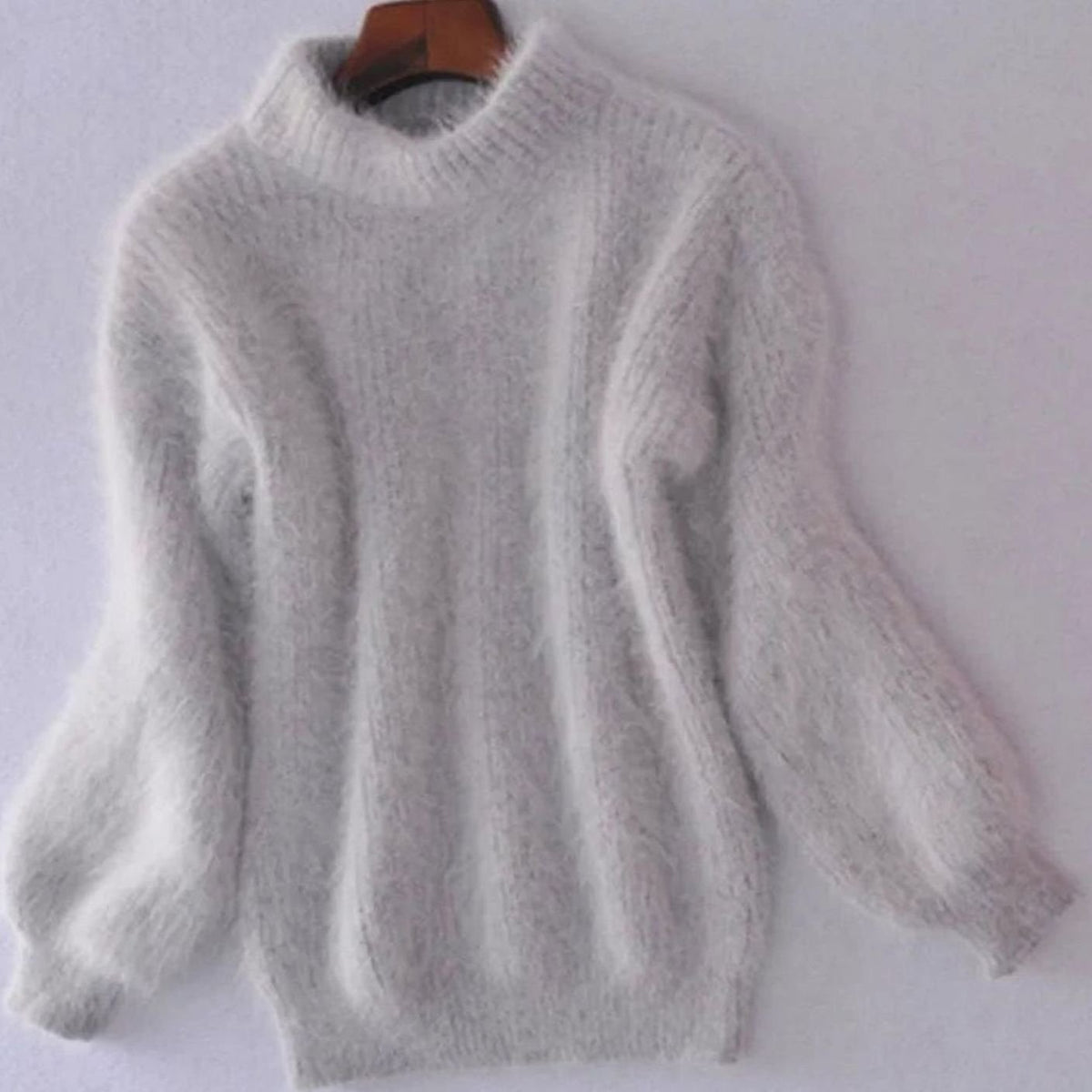 Women's relaxed-fit fuzzy rib-knit turtleneck sweater with wide sleeves, by Homixa, featuring a cozy, fluffy knit texture.