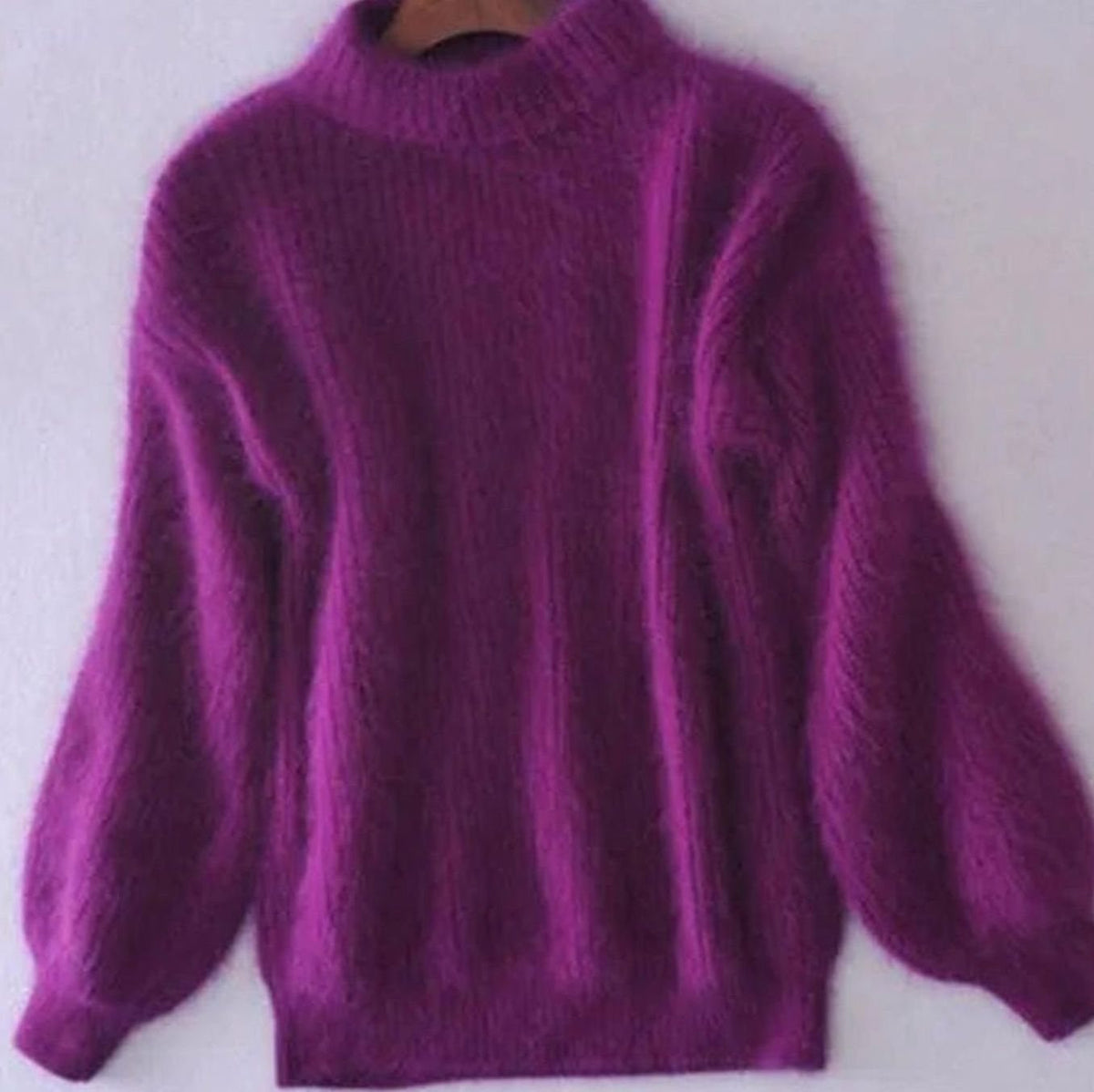 Women's fuzzy rib-knit turtleneck sweater with relaxed fit and wide sleeves by Homixa, showcasing its soft, fluffy texture and cozy design.