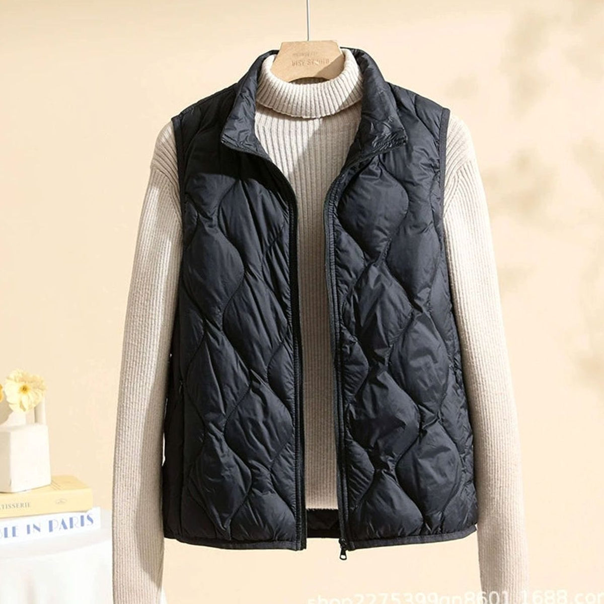 Women's relaxed-fit quilted puffer vest with stand collar and warm filling, featuring a sleeveless design by Homixa.