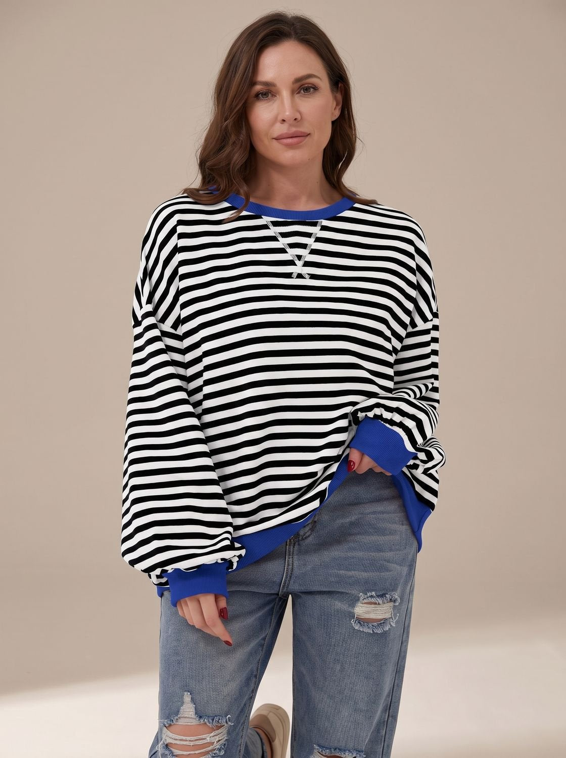 Women's retro striped oversized crew-neck sweatshirt by Homixa with contrast trim, featuring bold horizontal stripe pattern and relaxed fit.