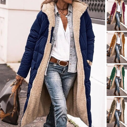 Women’s reversible longline Sherpa jacket by Homixa with hood and textured fleece detail, showcasing cozy, soft fabric and stylish design.
