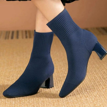 Women's ribbed-knit sock booties with block heel and stretch pull-on shaft by Homixa, shown from a side angle.