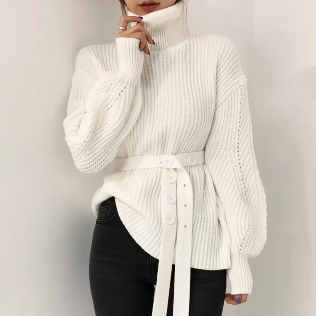 Women’s ribbed-knit turtleneck sweater with long sleeves and wide waist belt, by Homixa, shown on a model.