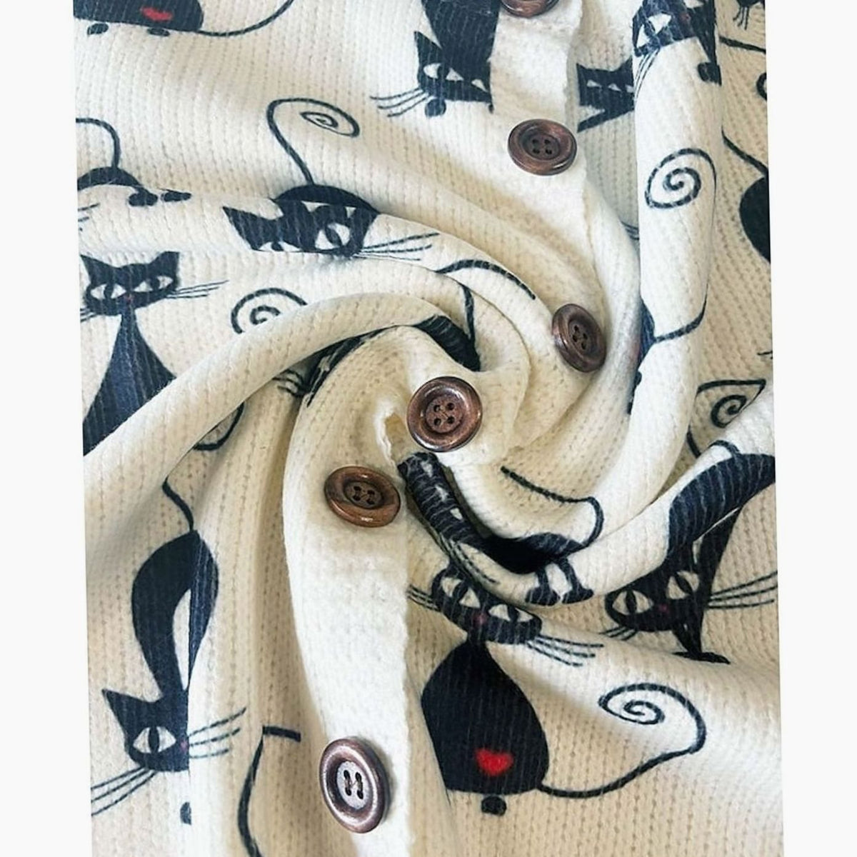 Women's floral cardigan by Homixa featuring a round-neck, knit fabric, and button-front closure with colorful floral pattern.