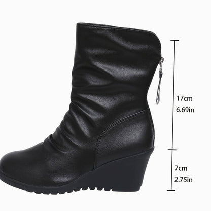 Women’s faux-leather wedge winter boots with side zipper and mid-calf shaft by Homixa, featuring ruched design and sturdy sole.