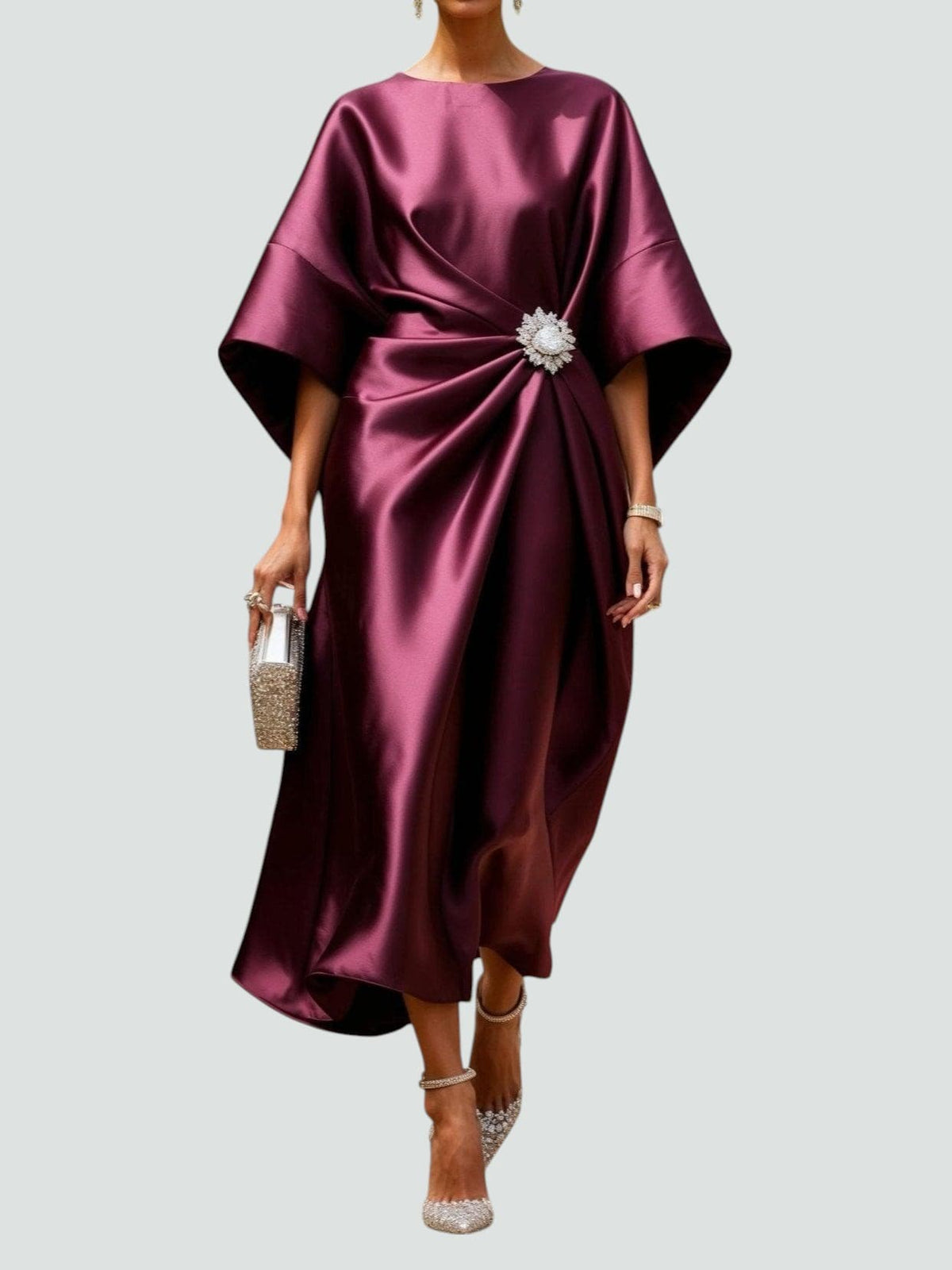 Elegant women's satin evening dress with twisted detail and gemstone embellishments by Homixa, showcasing a luxurious and sophisticated design.