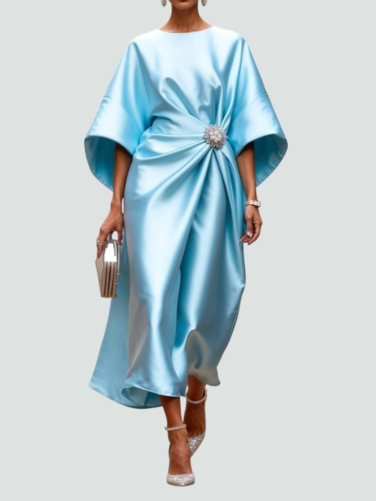 Elegant women's satin evening dress by Homixa featuring twisted design and gemstone embellishments, shown on a model.