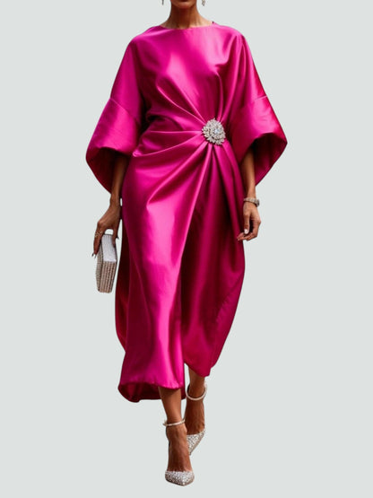 Elegant women's satin evening dress by Homixa featuring twisted design and gemstone embellishments, showcased on a model.