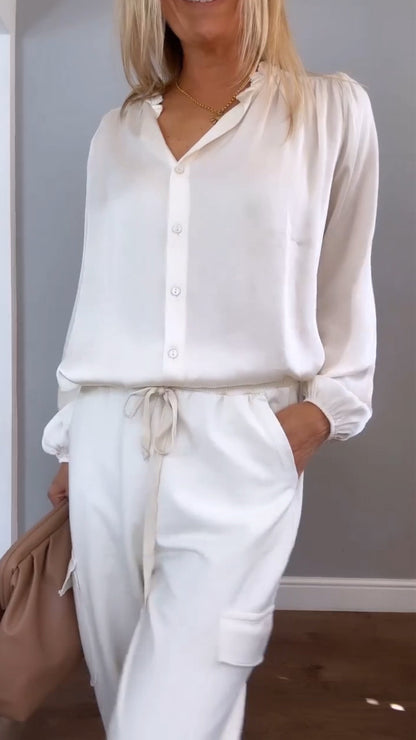 Women's satin two-piece set by Homixa featuring a V-neck button blouse and elastic-waist pants, styled for a chic look.