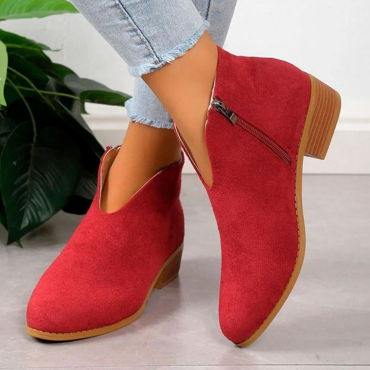 Homixa women's pointed-toe ankle booties with side zipper, block heel, and V-cut ankle shaft showing stylish footwear detail.