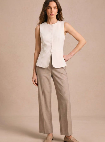 Women's sleeveless button-front vest by Homixa featuring a fitted waist and curved front hem, shown on a model.