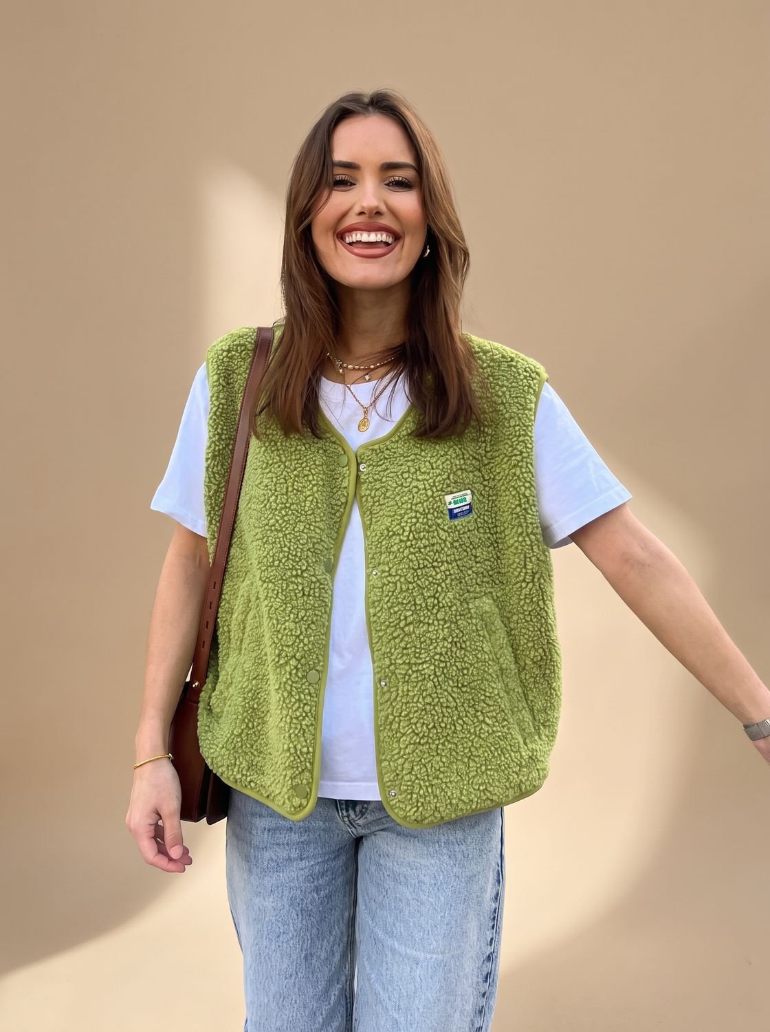 Women's sleeveless fleece vest by Homixa with snap-button closure and relaxed fit, featuring soft fleece fabric and casual style.
