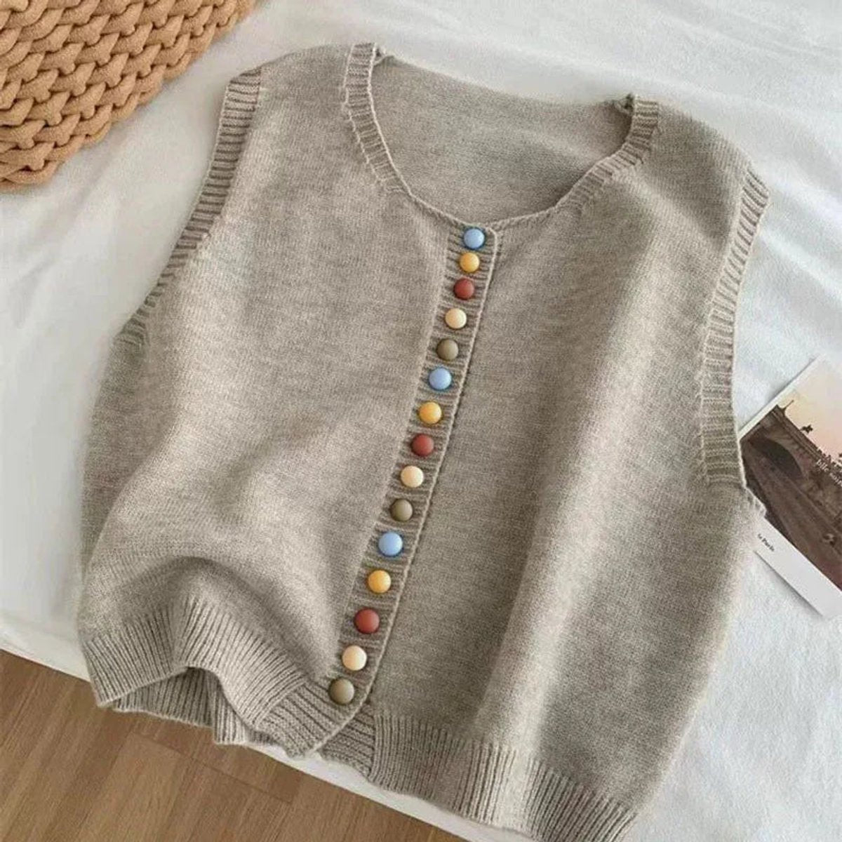 Women's sleeveless knit vest by Homixa featuring a multicolored button front and classic crew neck style.