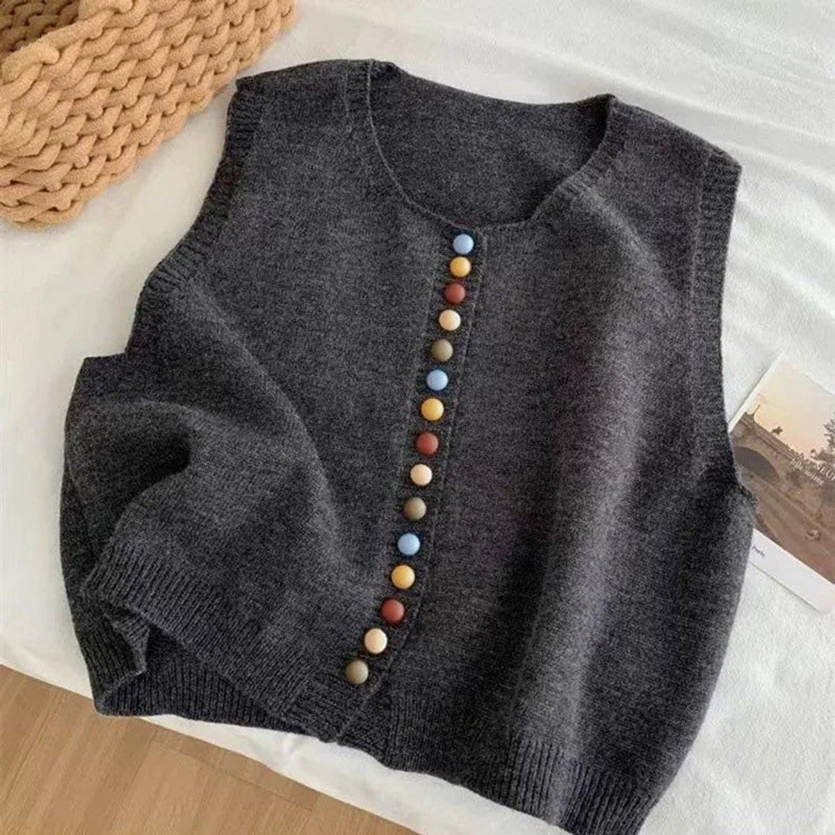 Women's sleeveless knit vest by Homixa featuring multicolored buttons, crew neck, and a stylish button-front design.