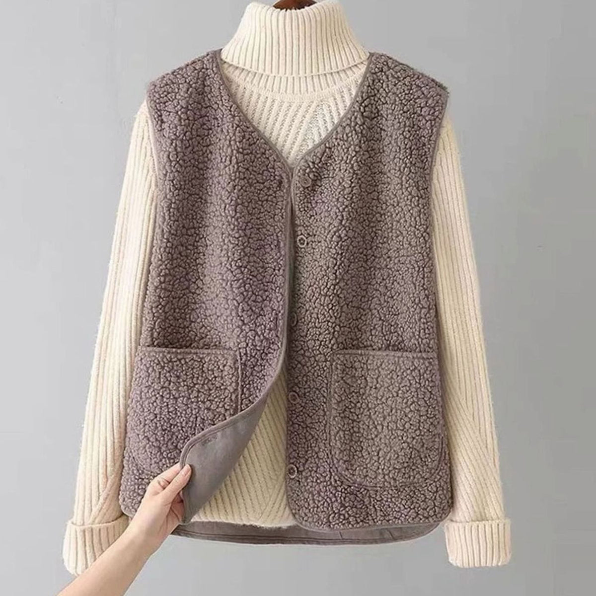 Women's sleeveless teddy fleece vest by Homixa with V-neck, button front, and two pockets, perfect for cozy layered style.