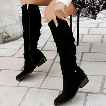 Women's slouchy suede-effect knee-high boots by Homixa with gathered shaft and low block heel on a model.