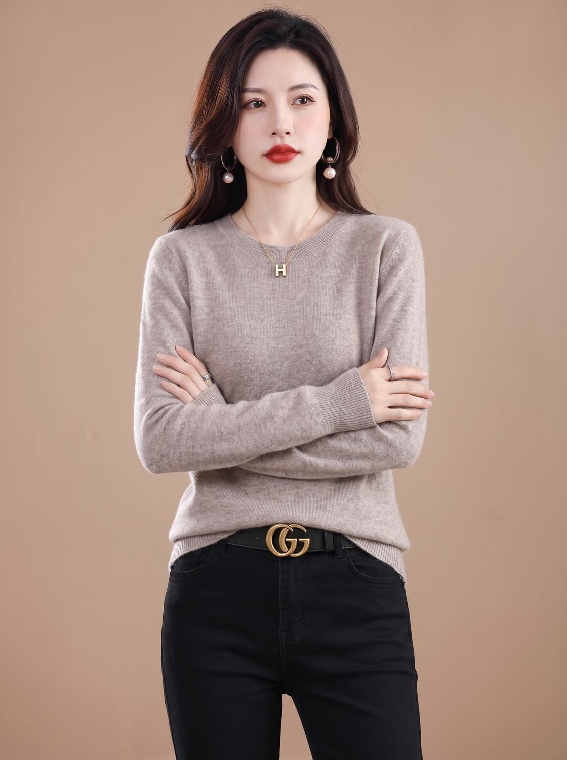 Women's soft cashmere crew-neck sweater with long sleeves and breathable knit, by Homixa, shown on a model.