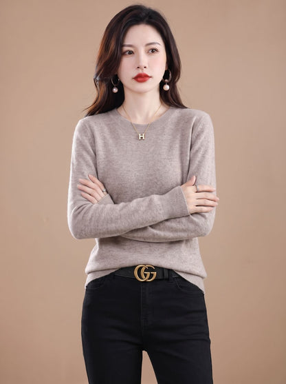 Women's soft cashmere crew-neck sweater with long sleeves and breathable knit, by Homixa, shown on a model.