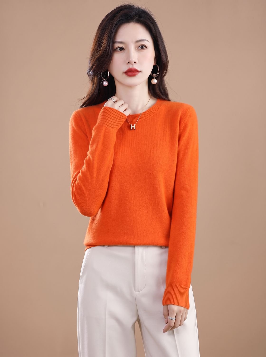 Homixa women's soft cashmere crew-neck sweater with long sleeves and breathable knit fabric, displayed on a model.