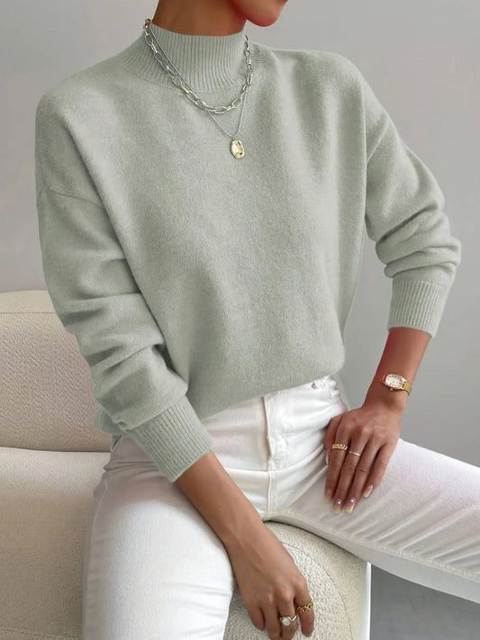 Homixa women's soft-knit turtleneck sweater with relaxed fit, drop shoulders, and ribbed cuffs, perfect for cozy winter wear.