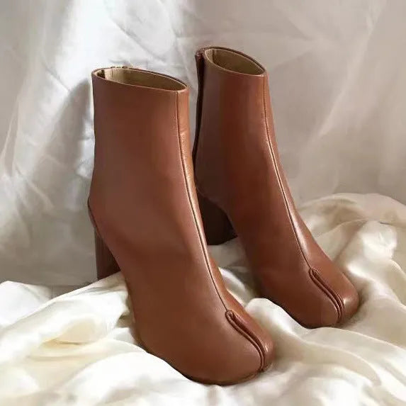 Women's split-toe ankle boots by Homixa featuring a low block heel and smooth leather-look finish, shown from the side.