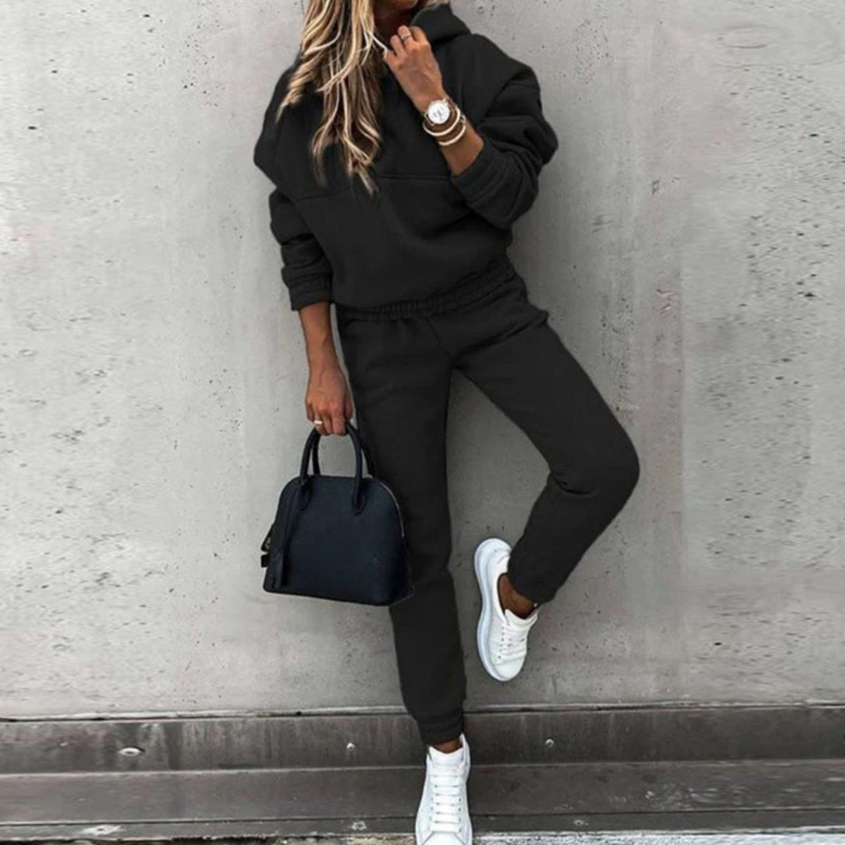 Women's Homixa stretch tracksuit set with relaxed hoodie and fitted jogger pants, shown in a casual, comfortable fit.