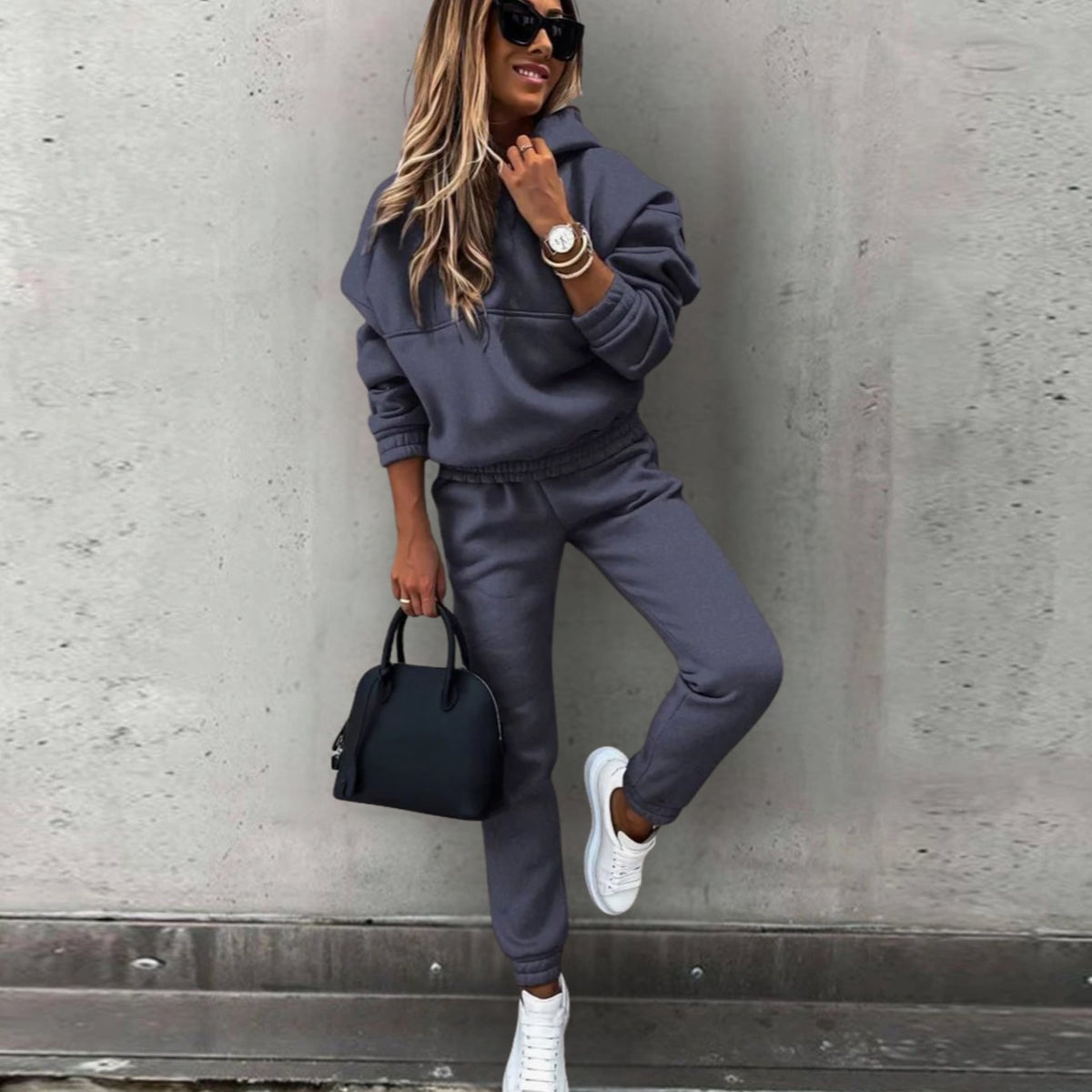 Homixa women's stretch tracksuit set featuring a relaxed hoodie and fitted jogger pants, ideal for casual and active wear.