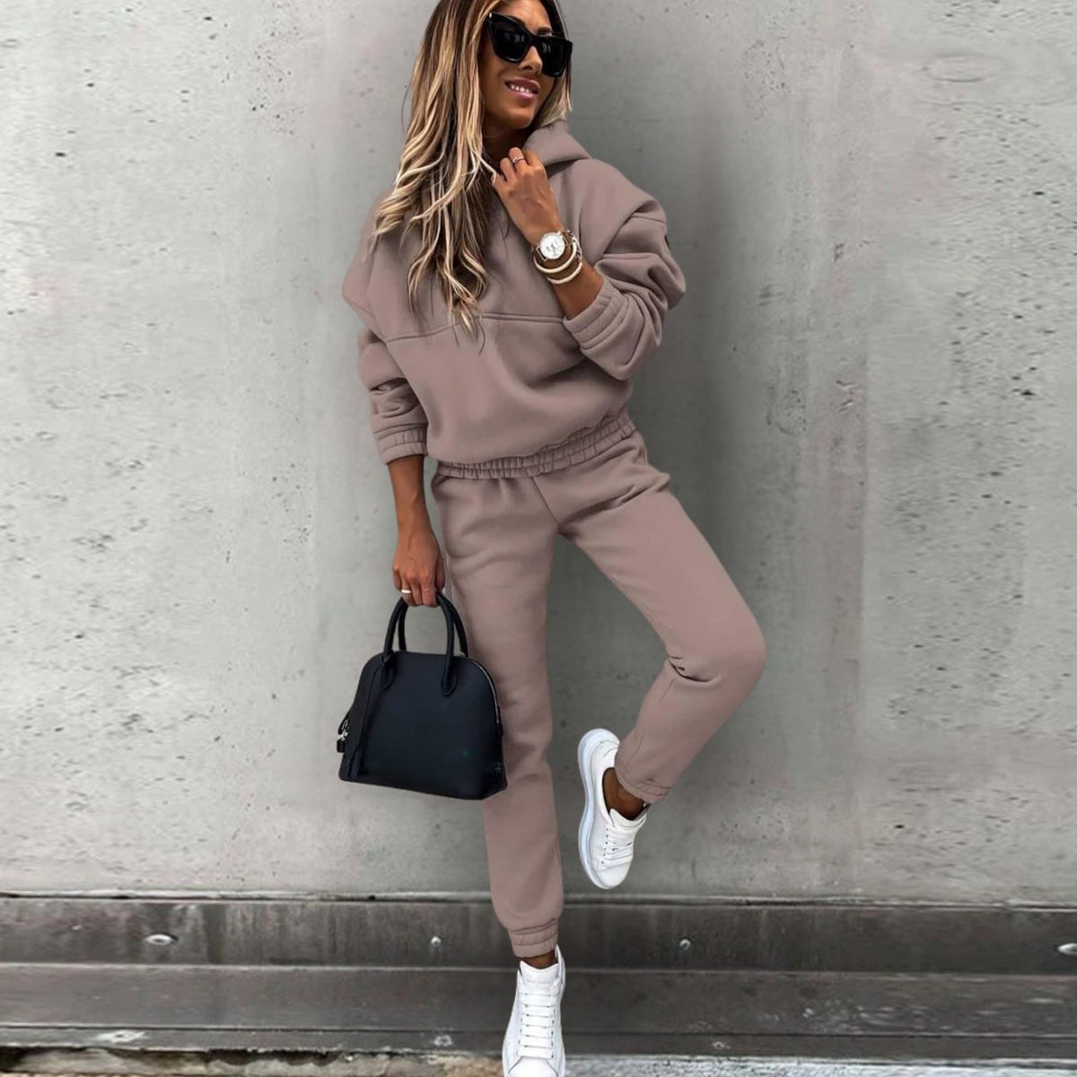 Women's Homixa stretch tracksuit set with relaxed hoodie and fitted jogger pants, shown in a casual, comfortable fit.