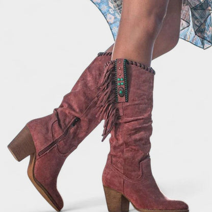Women’s suede knee-high Western boots with fringe and turquoise concho details by Homixa.