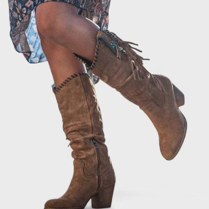 Women's suede knee-high western boots by Homixa featuring fringe detailing and turquoise concho accents.