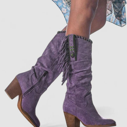 Women's suede knee-high Western boots by Homixa featuring fringe detailing and turquoise concho accents.