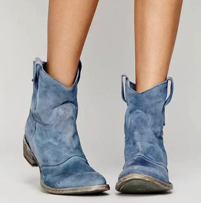 Homixa women's suede western ankle boots with curved stitching, round toe, and low block heel on a neutral background.