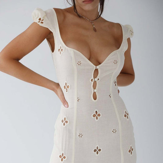 Women’s summer midi dress by Homixa featuring a cutout-inspired pattern, perfect for wedding guests, shown on a model.