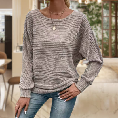 Women's Homixa sweater with horizontal ribbing, wide round neckline, and cuffed sleeves, displayed on a model.