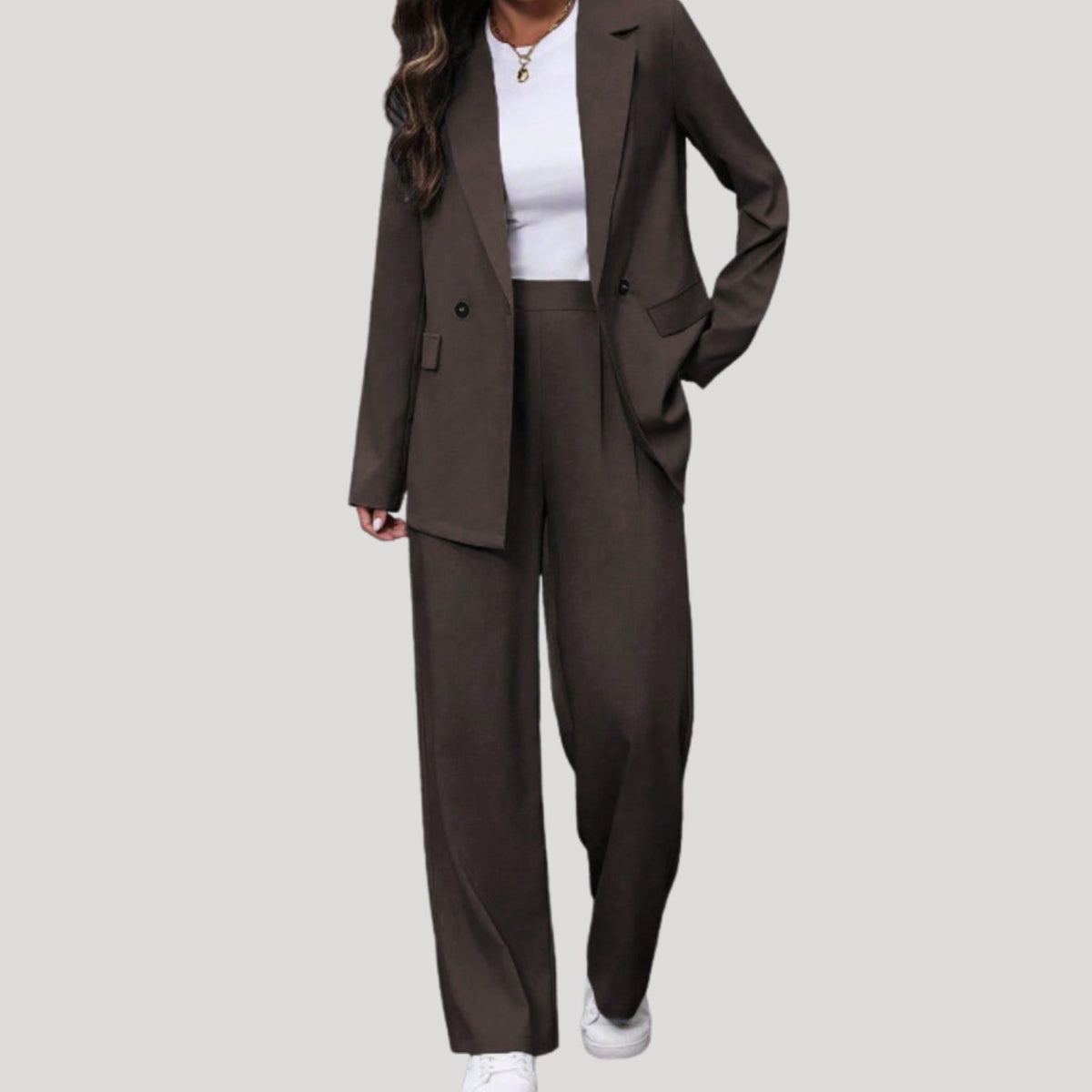 Women's tailored double-breasted suit set with wide-leg pants and fitted blazer by Homixa, displayed on a hanger against a neutral background.