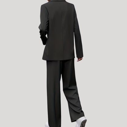 Women's tailored pant suit by Homixa featuring a double-breasted blazer and pleated wide-leg pants, stylish and sophisticated.